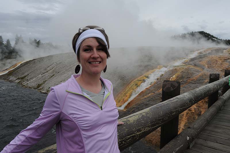 A girl smiling during the tour of Yellowstone