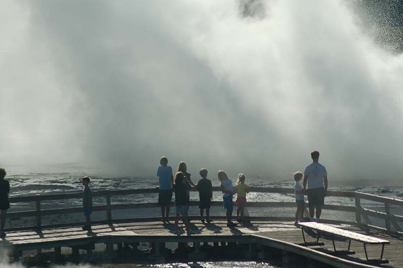 Yellowstone, people enjoying geysers.
